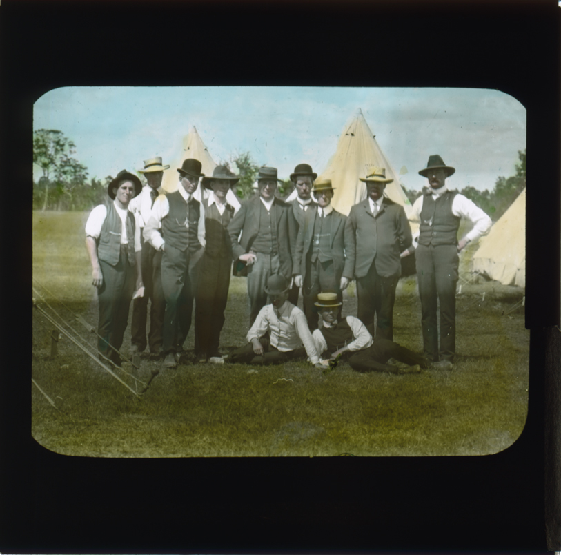 Eleven men gathered in front of camp site (possibly a Winter School) [Hawkesbury Agricultural College (HAC)]