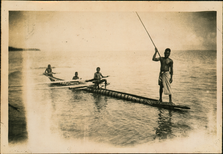 Fishing from a canoe off New Britain Island