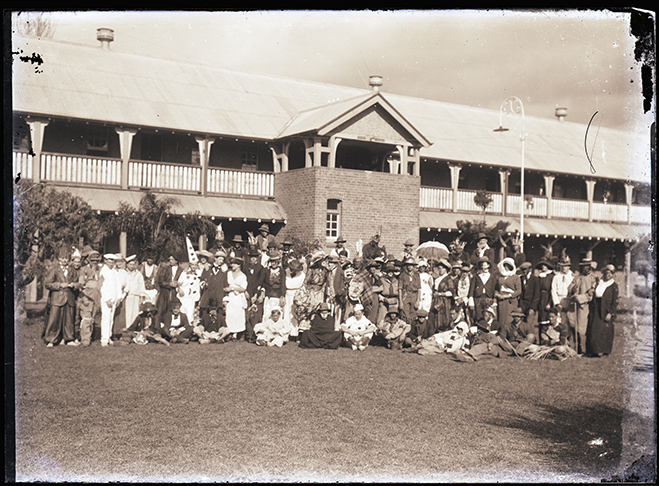 Large group of students in quadrangle dressed in costume, possibly for Empire Day celebrations [Hawkesbury Agricultural College (HAC)]