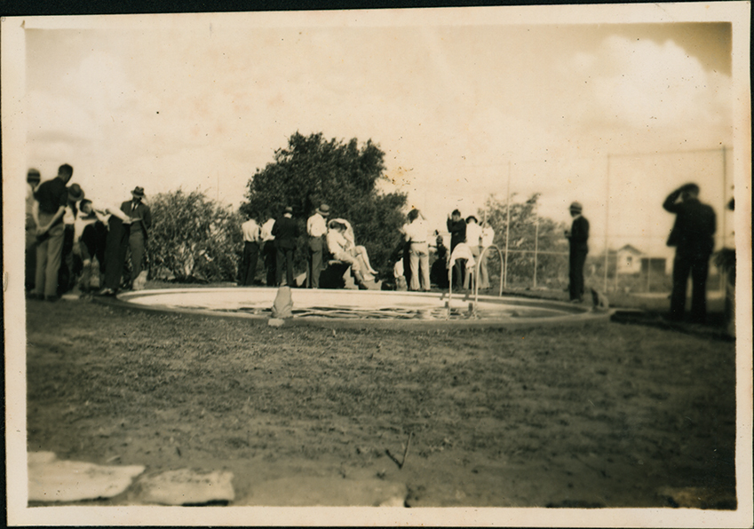 Group of students around a pool