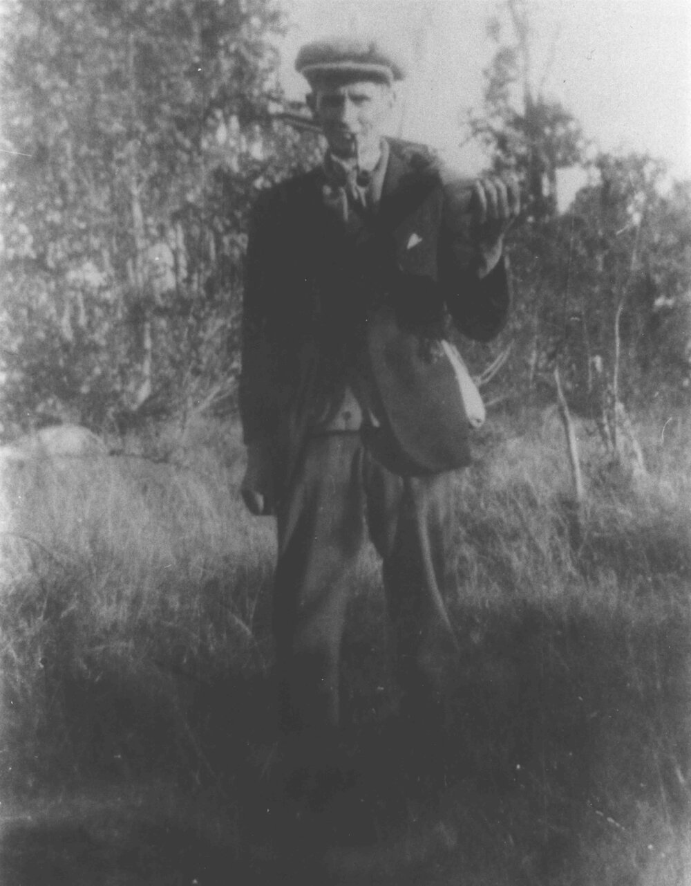 Spence Reid - Manager of the River Farm, standing in a paddock [Hawkesbury Agricultural College (HAC)]
