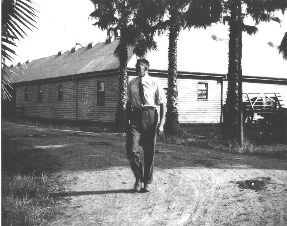 Wallace R (Roy) Watkins, Farm Manager, walking past Stable Square [Hawkesbury Agricultural College (HAC)]