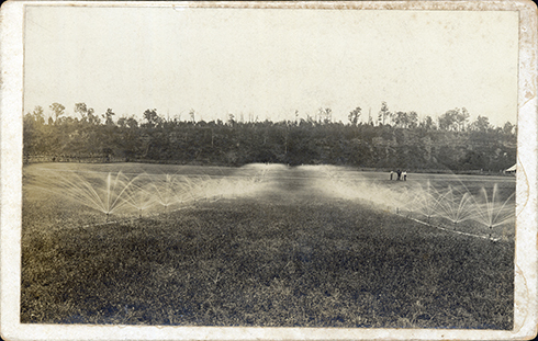 Irrigation spray on the River Farm - three men watching [Hawkesbury Agricultural College (HAC)]