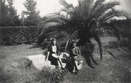 Women's Land Army: Faming activities (print 07 of 12) - Two women seated in front of a palm [Hawkesbury Agricultural College (HAC)]