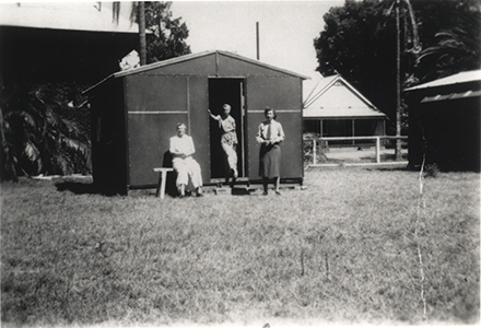 Women's Land Army: Faming activities (print 08 of 12) - Three women in front of a shed [Hawkesbury Agricultural College (HAC)]