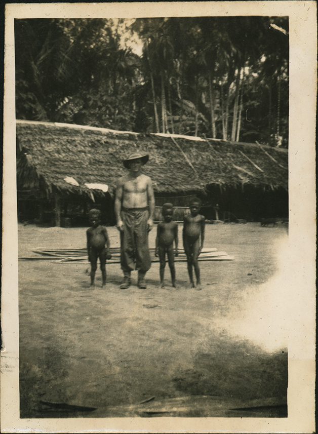 Bob Burrows with Native Children - Cassia Village (near Hoskins Airfield, New Britain Island, Papua New Guinea)