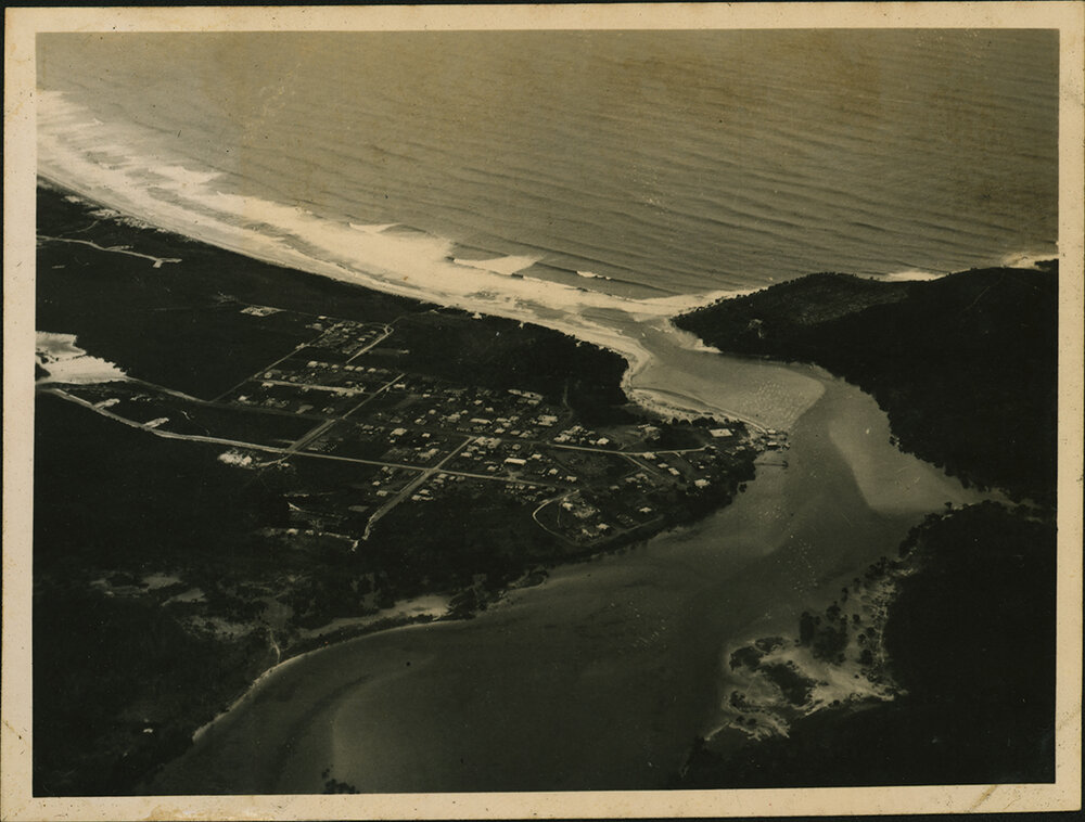 Aerial Photograph - Unidentified coastal town and river mouth
