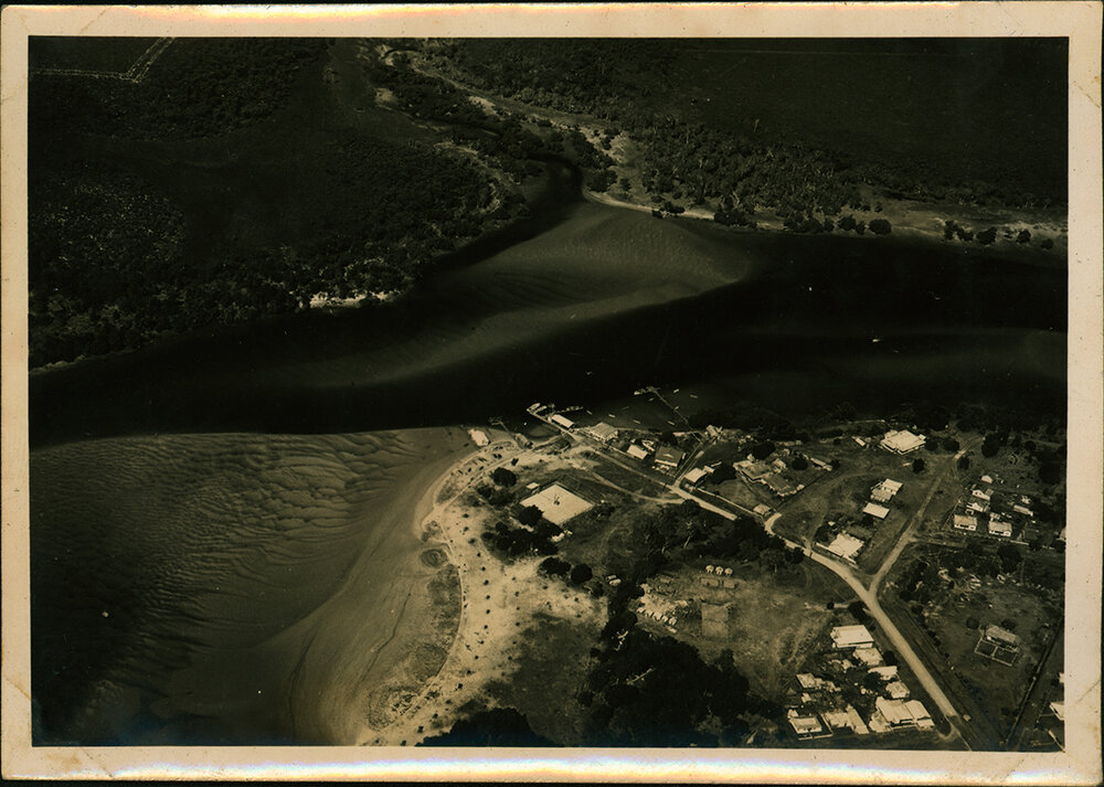 Aerial Photograph - Unidentified coastal town and river mouth