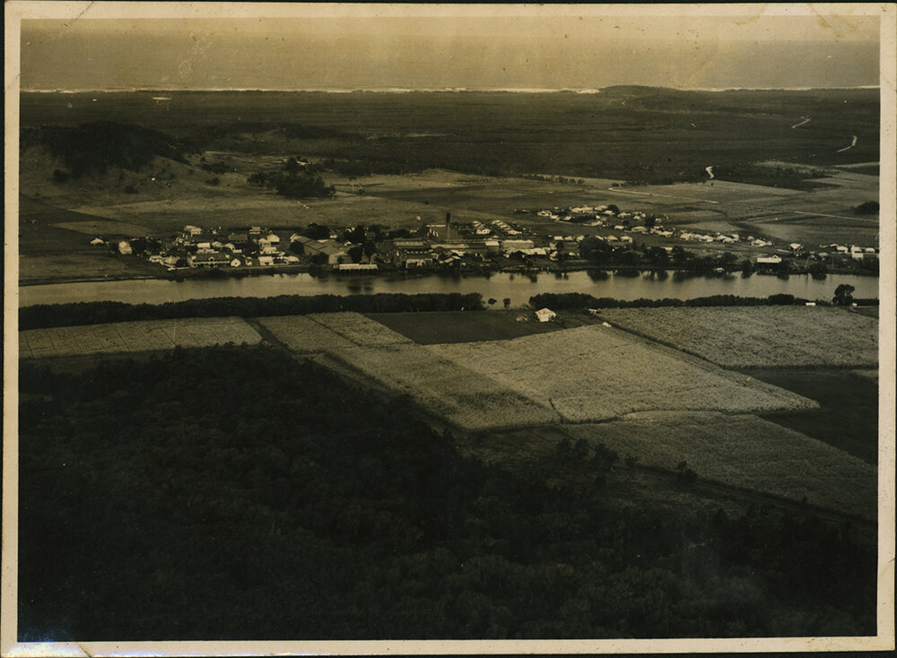 Aerial Photograph - Unidentified coastal town on a river