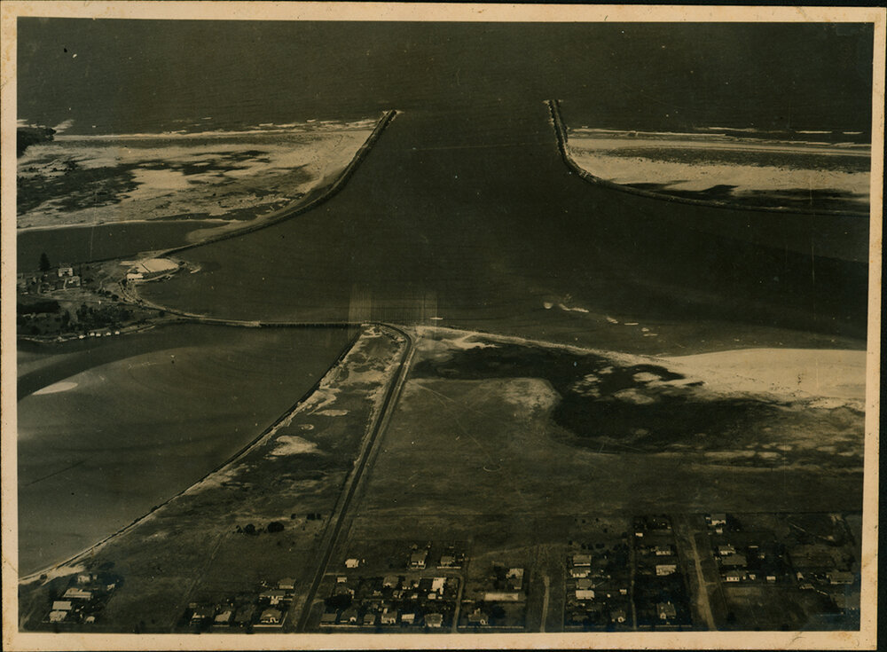 Aerial Photograph - Unidentified coastal town and river mouth