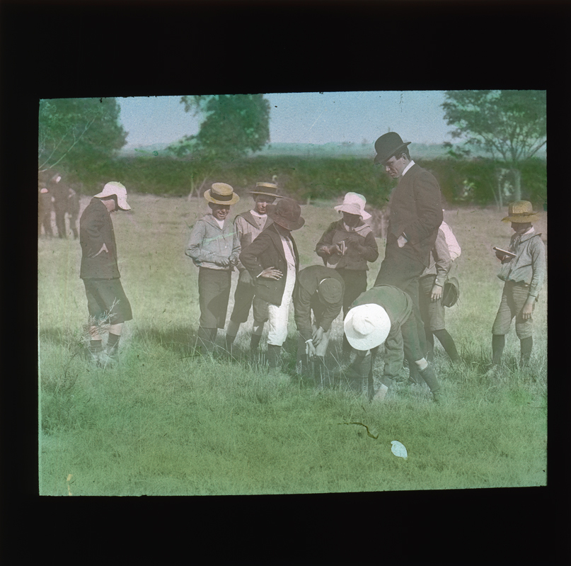 Boys and teacher in a field [Hawkesbury Agriculutural College (HAC)]