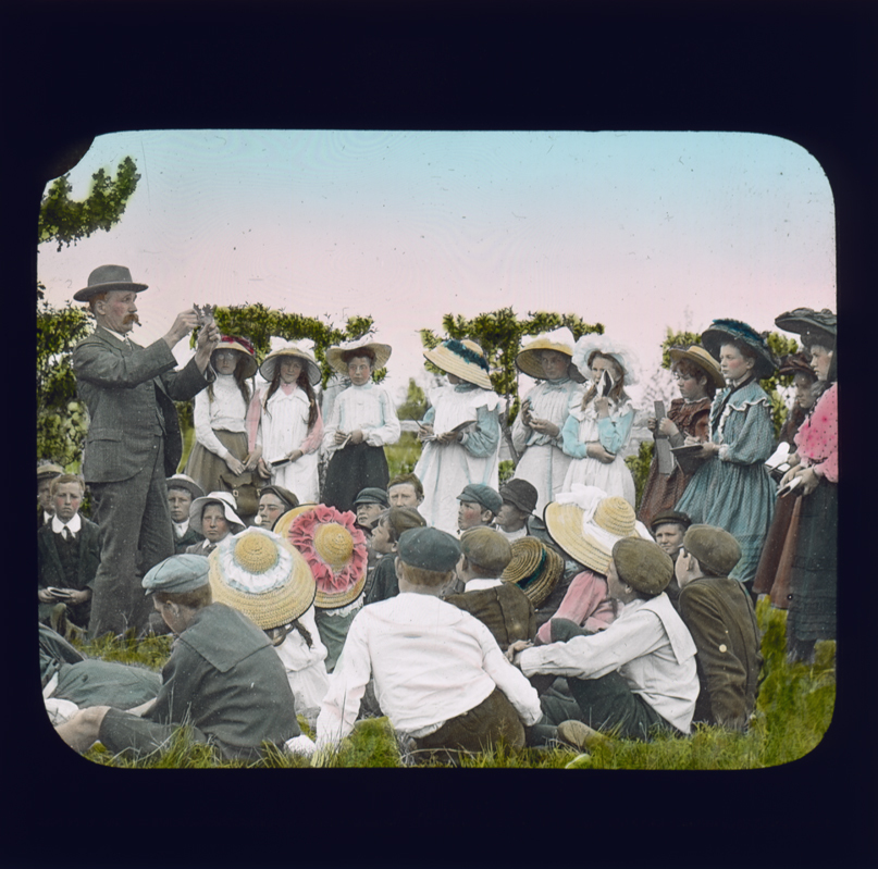 Charles T Musson, Lecturer in Botany and Entomology, giving a class outside to a group of school children [Hawkesbury Agricultural College (HAC)]