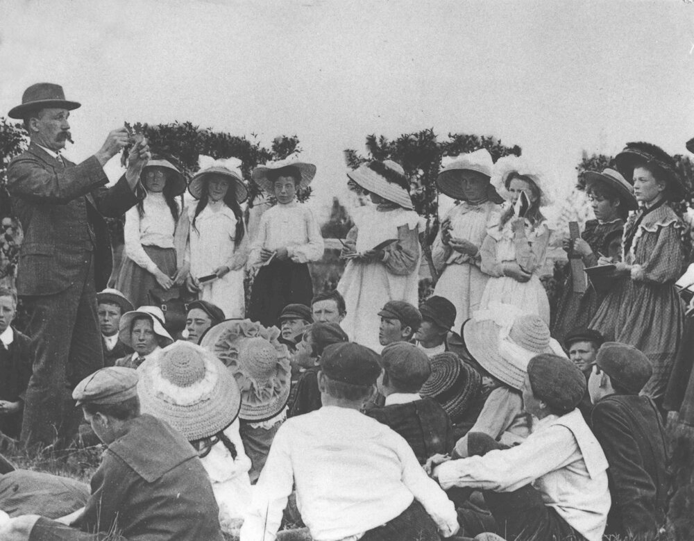 Charles T Musson, Lecturer in Botany and Entomology, giving a class outside to a group of school children [Hawkesbury Agricultural College (HAC)]