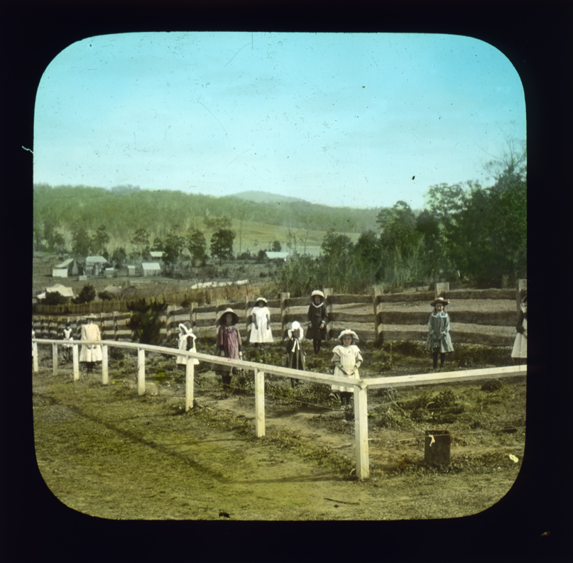 Women and young girls in garden [Hawkesbury Agricultural College (HAC)]