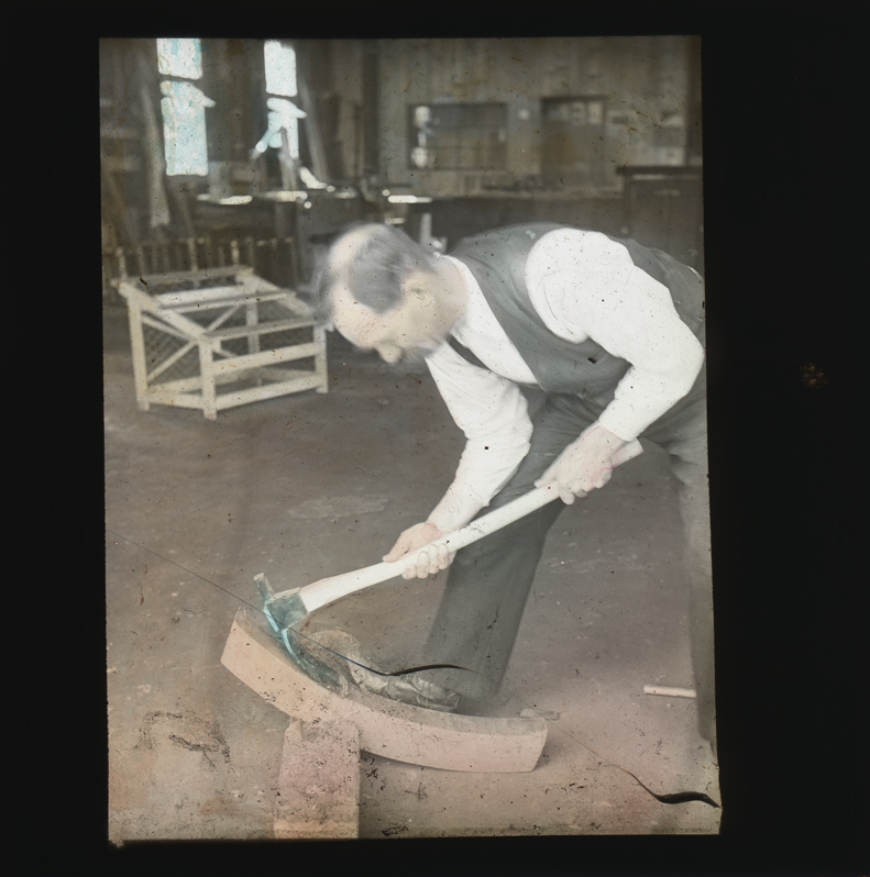 Musson shaping timber using an adze [Hawkesbury Agricultural College (HAC)]