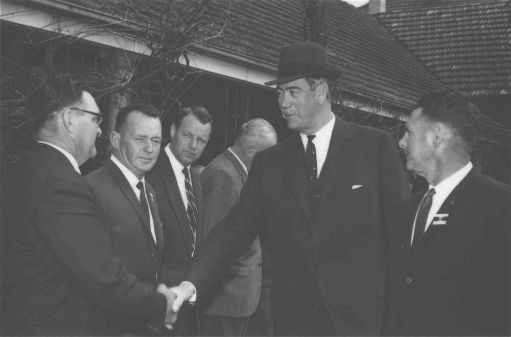 Sir Roden Cutler (Governor of NSW) shaking hands with an unidentified man [Hawkesbury Agricultural College (HAC)]