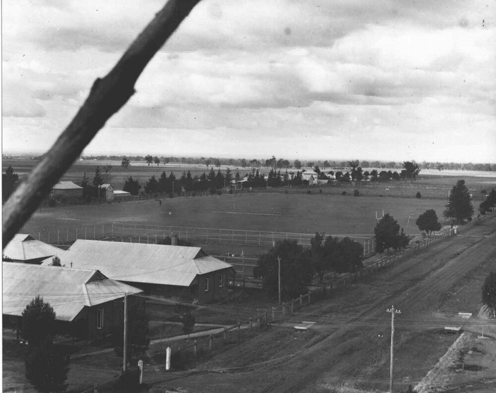 View over Stewards Quarters, playing field (oval) to Dairy lane with Plots Building and Store Tobacco curing house [Hawkesbury Agricultural College (HAC)]