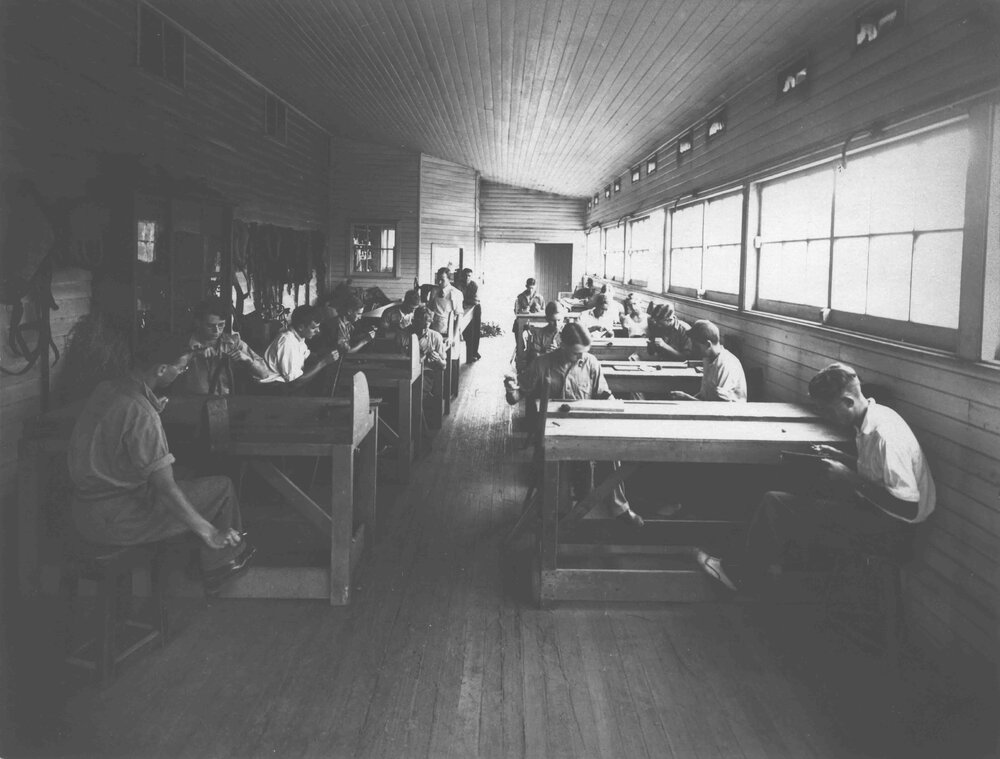 Saddlery Shop (interior) - Students at work with instructor looking on [Hawkesbury Agricultural College (HAC)]