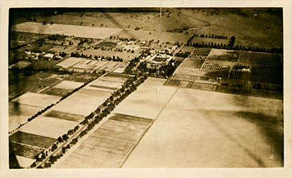 Aerial views of Hawkesbury Agricultural College, showing administrative and accommodation blocks, stable square, dairy and orchard buildings, and the front drive [Hawkesbury Agricultural College (HAC)] - Print 1 of 2