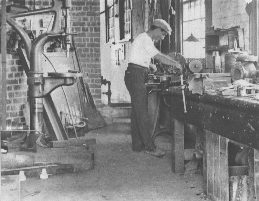 Engineering Workshop (interior) - Student at work [Hawkesbury Agricultural College (HAC)]