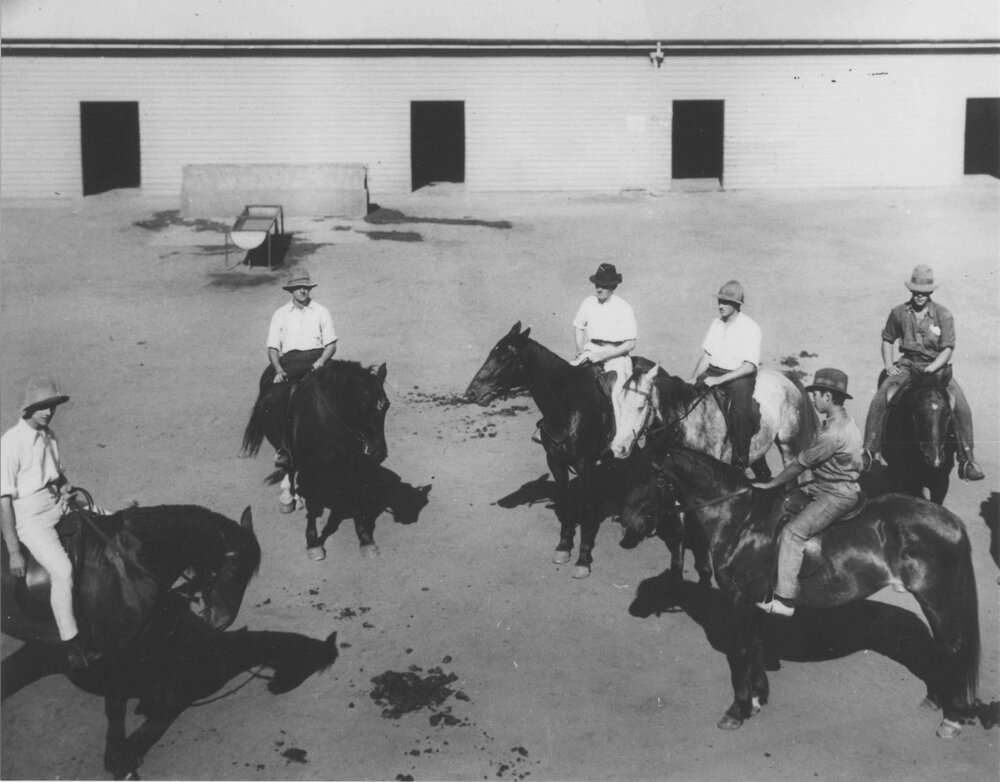 Riding School - Students (all wearing hats) mounted on horses inside Stable Square [Hawkesbury Agricultural College (HAC)]