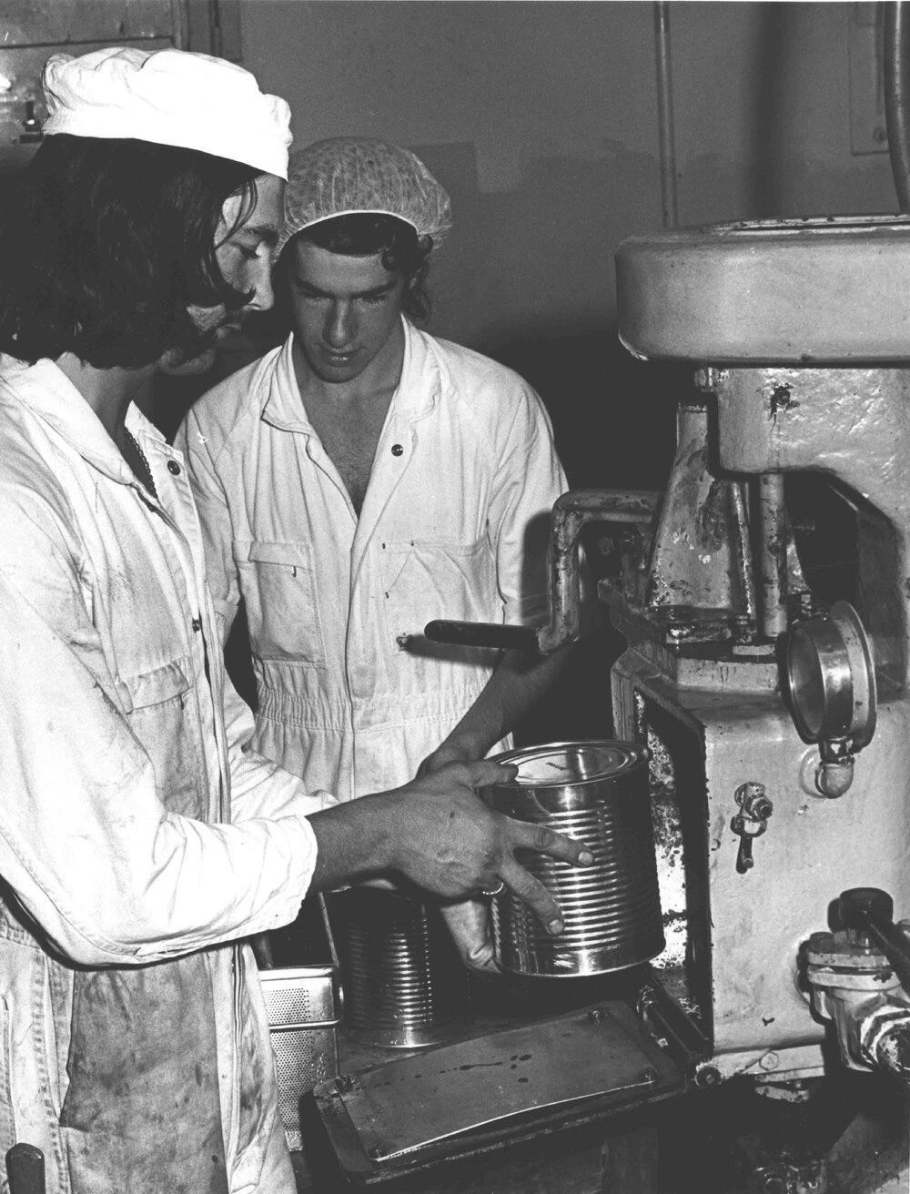 Cannery: Student putting large can of produce into an oven [Hawkesbury Agricultural College (HAC)]
