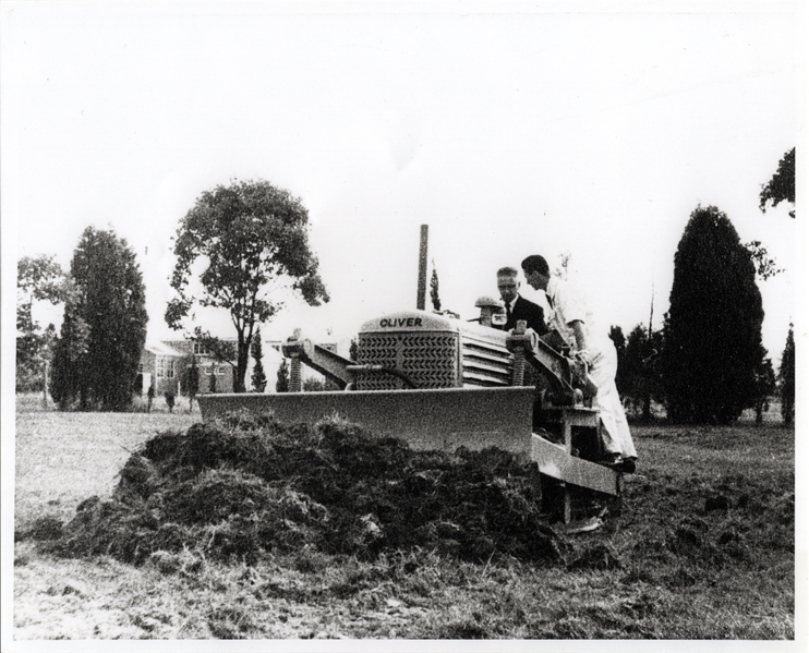 Olympic Swimming Pool Construction - Mr Roger B Nott, Minister for Agriculture and Food Production, turning first sod for the new pool in a bulldozer [Hawkesbury Agricultural College (HAC)]