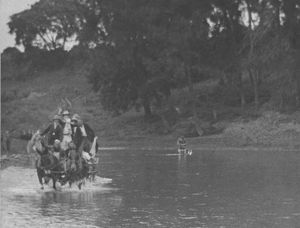 Students crowded onto a cart pulled by two horses, crossing the Nepean River at Yarramundi Ford [Hawkesbury Agricultural College (HAC)]