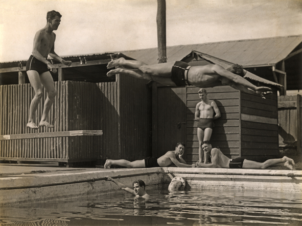 Swimming Pool (first) - Student diving (mid-air) from the board while others watch [Hawkesbury Agricultural College (HAC)]