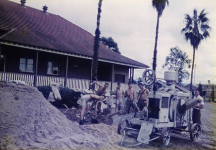 Olympic Swimming Pool - Construction (print 04 of 18) - Students mixing concrete using a large concrete mixer [Hawkesbury Agricultural College (HAC)]