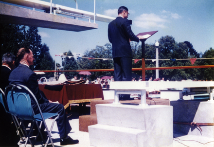 Olympic Swimming Pool - Opening (print 16 of 18) - The official opening of the pool, with Harry Richardson (Principal) standing at a lectern [Hawkesbury Agricultural College (HAC)]