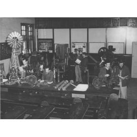 Students working in the Mechanical Laboratory - with working model of a Comet windmill [Hawkesbury Agricultural College (HAC)]