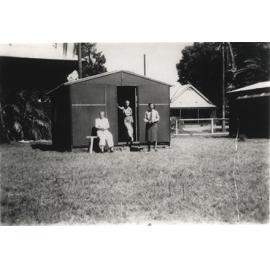 Women's Land Army: Faming activities (print 08 of 12) - Three women in front of a shed [Hawkesbury Agricultural College (HAC)]