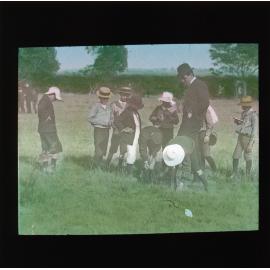 Boys and teacher in a field [Hawkesbury Agriculutural College (HAC)]