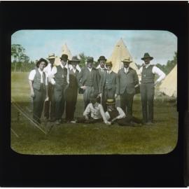 Eleven men gathered in front of camp site (possibly a Winter School) [Hawkesbury Agricultural College (HAC)]