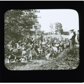 Group of school students sitting under a tree listening to a teacher [Hawkesbury Agricultural College (HAC)]