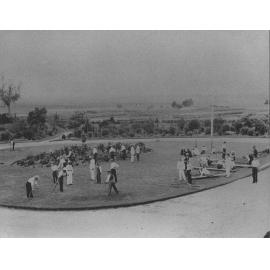 Students scything front lawn under instruction [Hawkesbury Agricultural College (HAC)]
