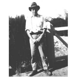 Student standing in front of a gate [Hawkesbury Agricultural College (HAC)]