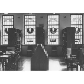 Memorial Library (interior) - bookcases (foreground) and stained-glass windows (background) [Hawkesbury Agricultural College (HAC)]