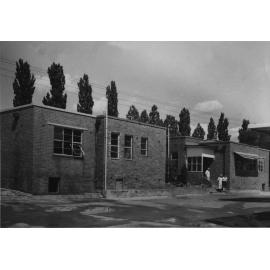 Dairy Factory Administration Building - three people on steps of main entrance [Hawkesbury Agricultural College (HAC)]
