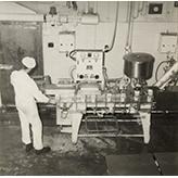 Dairy Factory (interior): students at work with machinery pouring milk into cartons (Print 9 of 9) [Hawkesbury Agricultural College (HAC)]