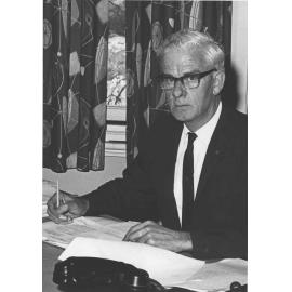 Portrait: Bernard ("Dick") Doman (Principal 1962-71) (1 of 7) - seated at a desk [Hawkesbury Agricultural College (HAC)]