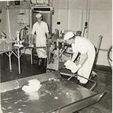Dairy Factory (interior): showing students at work and machinery - cutting & packaging butter (Print 6 of 9) [Hawkesbury Agricultural College (HAC)]