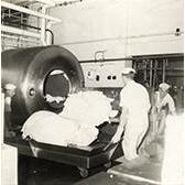 Dairy Factory (interior): showing students at work and machinery - making butter (Print 5 of 9) [Hawkesbury Agricultural College (HAC)]
