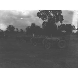 Four tractors on display in a paddock [Hawkesbury Agricultural College (HAC)]