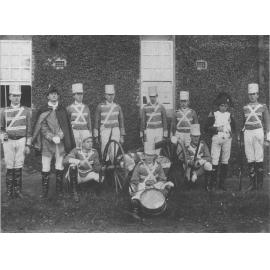 Empire Day - Students dressed up - English army uniforms, with a cannon and drum as props [Hawkesbury Agricultural College (HAC)]