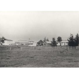 Dairy buildings from left (East) silos, cow bails and feeding stalls, calf pens, dairy factory (print 2 of 2) - Cropped version [Hawkesbury Agricultural College (HAC)]