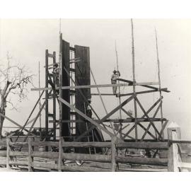 Construction of twin timber silos at the Dairy - construction workers standing on scaffolding (Print 1 of 2) - Cropped version [Hawkesbury Agricultural College (HAC)]
