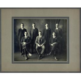 Formal photograph of seven young men - four standing behind three seated [Hawkesbury Agricultural College (HAC)]