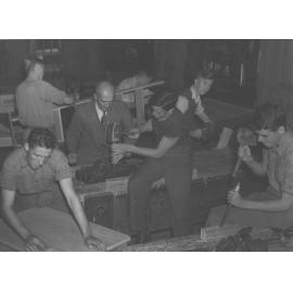 Students working at carpentry benches under supervision of staff member [Hawkesbury Agricultural College (HAC)]